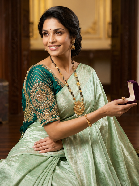 Ethereal Mint Green Tissue Silk Saree | Subtle Gold Zari & Tassel Detailing