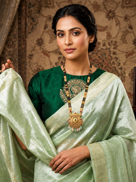 Ethereal Mint Green Tissue Silk Saree | Subtle Gold Zari & Tassel Detailing